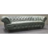 A green leather Chesterfield settee 68x242x107cm