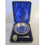 A childs silver bowl and feeding spoon (cased)