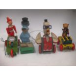 A collection of mid 20th century toys; pull along toys, Noddy's Lincoln car, Pelham policeman,