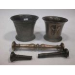 An antique bronze mortar decorated with a crowned Tudor rose with a pestle, 10.5cm high, another