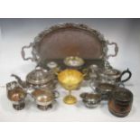 A collection of silver plated items: candelabra, ladles, grape scissors, large tureen with cover,
