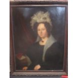 A 19th century portrait of a lady, oil on canvas, in a dark wooden carved frame, 89 x 69cm