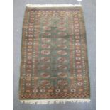 A hand-knotted Bokhara rug,