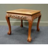 A Chinese hardwood occasional table, carved with dragons, 56 x 59 x 61cm