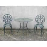 A metal green painted circular garden table and two chairs (3)