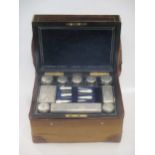 A rosewood and brass inlaid lady's travelling vanity case, containing silver plated mounted glass