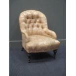 A Victorian button back chair with yellow floral upholstery, the serpentine fronted seat above
