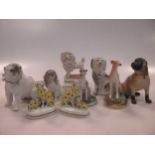 A group of nine small ceramic model dogs, mainly Continental (9)