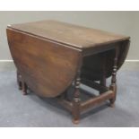 A large oak gateleg table with oval top and end drawer, on turned supports 75 x 183 x 127cmCondition