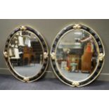 A pair of Christopher Guy oval wall mirrors, 112 x 92cm