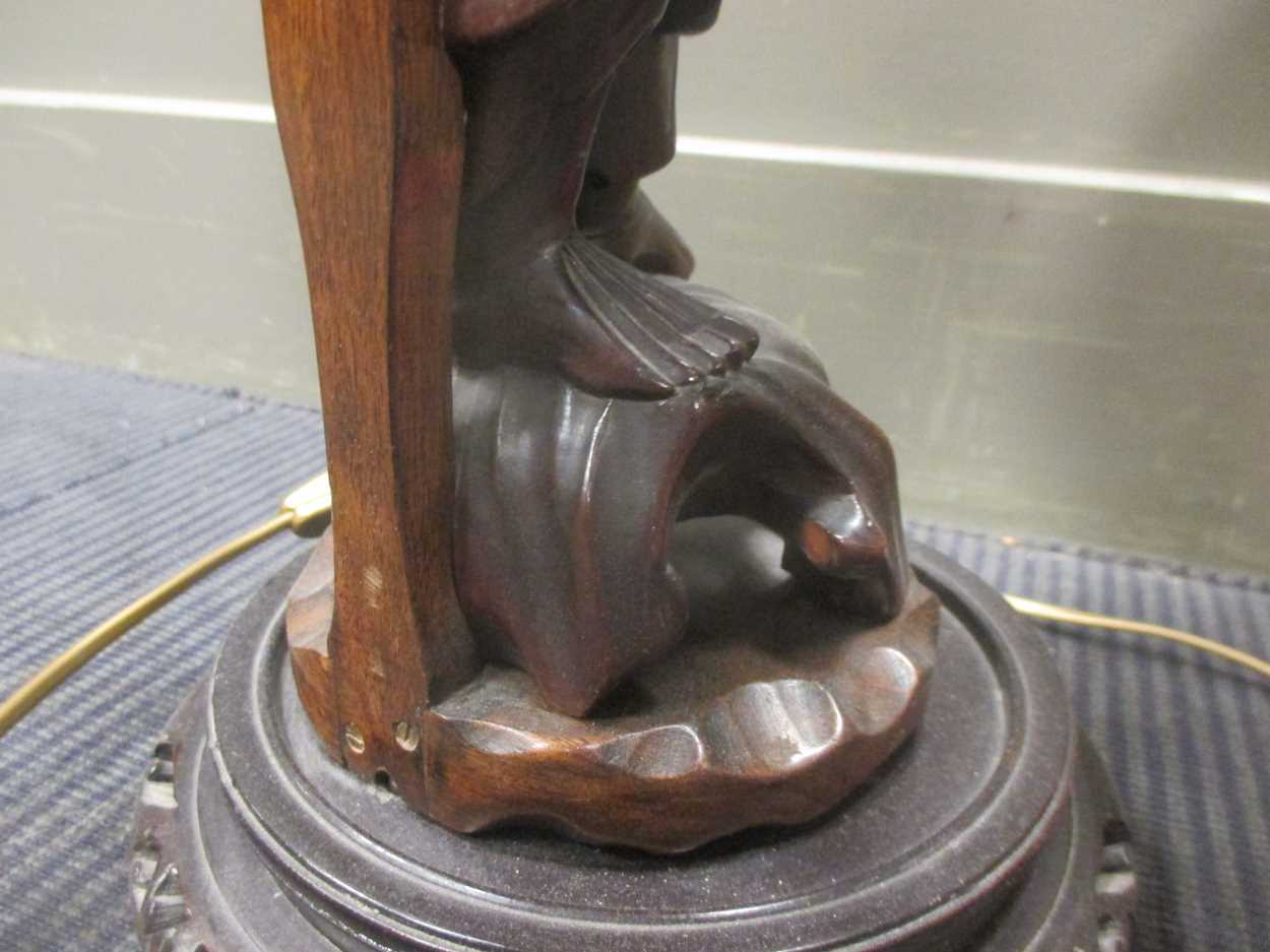 A Chinese carved wood figure adapted into a lamp base together with a French lamp and a pair of - Image 4 of 9