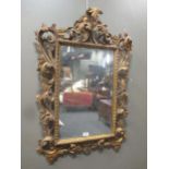 An 18th century style Florentine giltwood wall mirror,