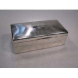 A silver table cigarette box, 21 x 10cm, cedar wood lined, with presentation engraved cover, 26.1ozt