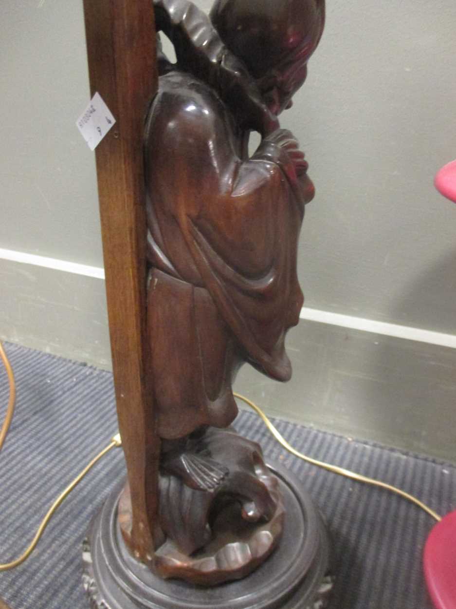 A Chinese carved wood figure adapted into a lamp base together with a French lamp and a pair of - Image 9 of 9