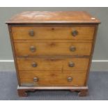 A small Georgian mahogany cabinet, adapted from a night commode, now with two fall fronts on bracket