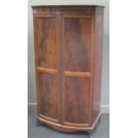 A mahogany two-door bow front wardrobe, 192 x 94 x 60cm