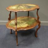 An Italian style two-tier table, painted tiers of lovers in a landscape, within a simulated rosewood
