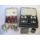 2 cased sets of six silver teaspoons and tongs, together with a further cased set of six