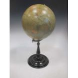 A Victorian style globe on ebonised wood stand, copy of an original by Merzbach and Falk, 56cm high