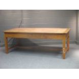 A continental fruitwood farm house table, with a freize drawer and a drawer to each end, with two