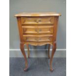 A French bedside cabinet, the serpentine front with three drawers on cabriole legs 68.5 x 41 x 29cm