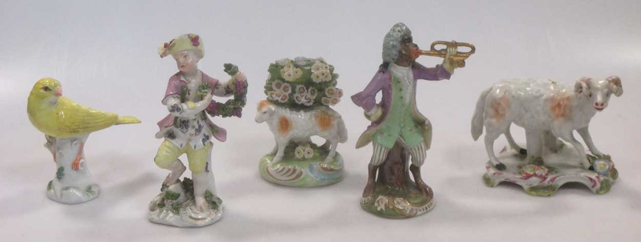 A 19th century Vienna porcelain figure of a monkey playing a trumpet, beehive mark; an 18th