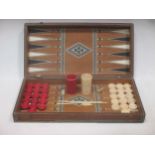 A 19th Anglo-Indian ivory and mosaic backgammon box with counters, shakers and dice 43x22 (losses)