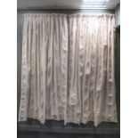 A pair of verticle striped cream coloured curtains (lined) each curtain measures approximately 105cm