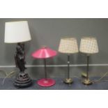 A Chinese carved wood figure adapted into a lamp base together with a French lamp and a pair of