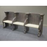 A 19th century Gothic oak three seated divided settle 98 x 237 x 45cm