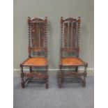 A pair of oak coronet carved hall chairs (2)