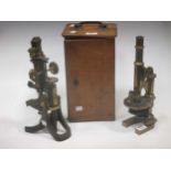 C. Barker, London, a cased brass microscope, together with another Swift example (2)