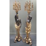 A pair of composite blackamoor candelabras, 210cm high