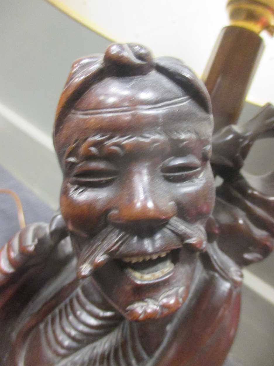 A Chinese carved wood figure adapted into a lamp base together with a French lamp and a pair of - Image 7 of 9