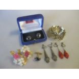 A collection of costume jewellery including three hematite cufflinks, a pair of marcasite