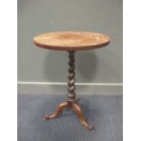 A Victorian circular mahogany occasional table on spiral turned column and scroll carved tripod