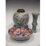 A Chinese Gu shape famille rose vase 24cm (badly damaged), a famille rose jar decorated with