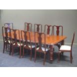 An early Victorian mahogany dining table, with two leaves, on turned legs with brass castors, 72 x