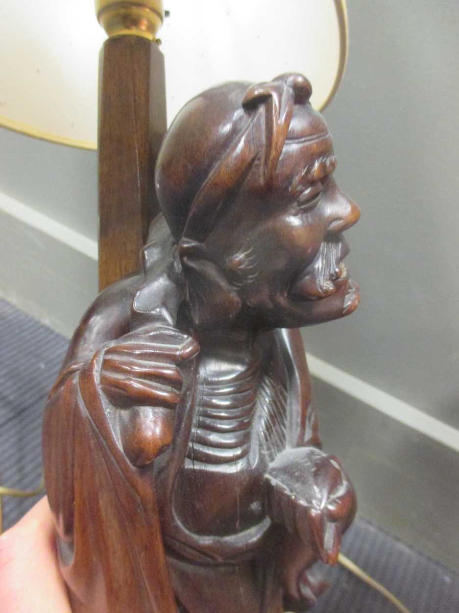 A Chinese carved wood figure adapted into a lamp base together with a French lamp and a pair of - Image 6 of 9