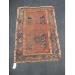 A red ground geometric tribal rug 167 x 113cm together with a yellow ground runner with three