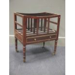 A George III style rosewood and gilt metal mounted canterbury, with four divisions above a drawer,