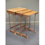 A nest of three marquetry occasional tables