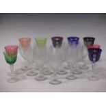 A collection of goblet wine glasses and tumblers and nine coloured bowl glasses etc