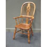 A 19th century style elm and burr elm seat hoop back windsor armchair, the broad arm rests over