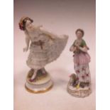 A Continental porcelain figure of a dancer with ruched dress and a female flute player with lamb (