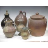 Three 20th century slipware dishes, 4 earthenware jugs and a vase, and another now fitted as a