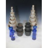 A colleciton of toleware flower towers, twelve Bristol blue glass vases and a pair of glass