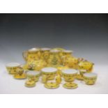 A Limoges Delvaux part dinner service, the yellow ground decorated with flowers together with a