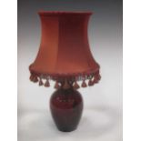 A Royal Doulton flambe camel landscape vase now fitted as a lamp, including shade 38cm
