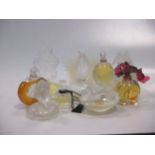 Twenty various 20th century Lalique perfume bottles